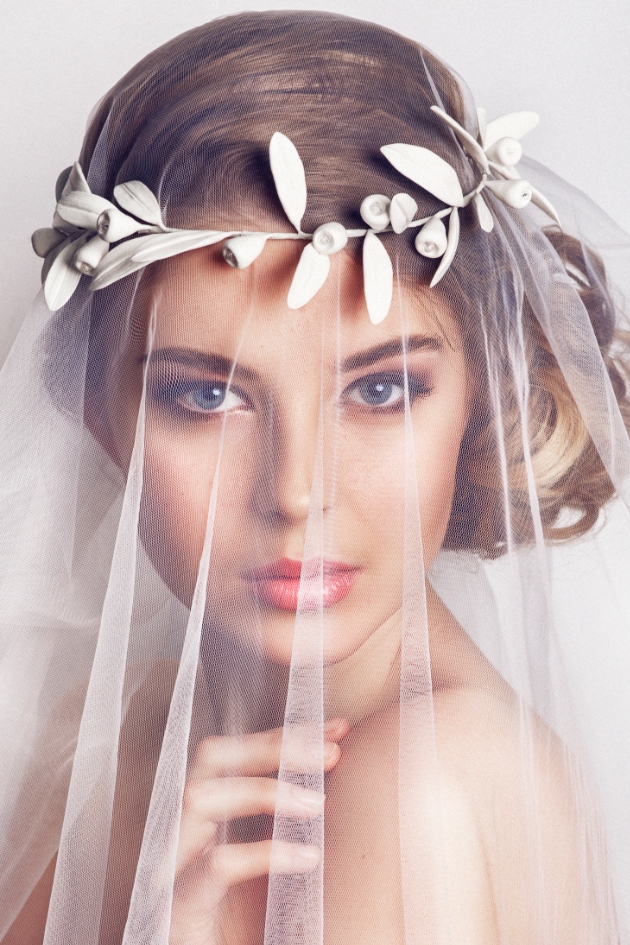 Bride wearing a veil and a white wreath