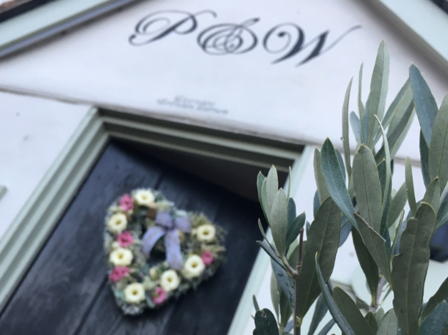 Floral wreath hangs on the door of Pig & Whistle Restaurant, Chelmsford