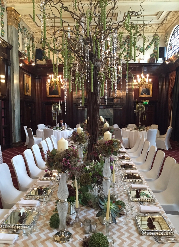 Luxurious wedding table decorated with candelabra, succulents and candles