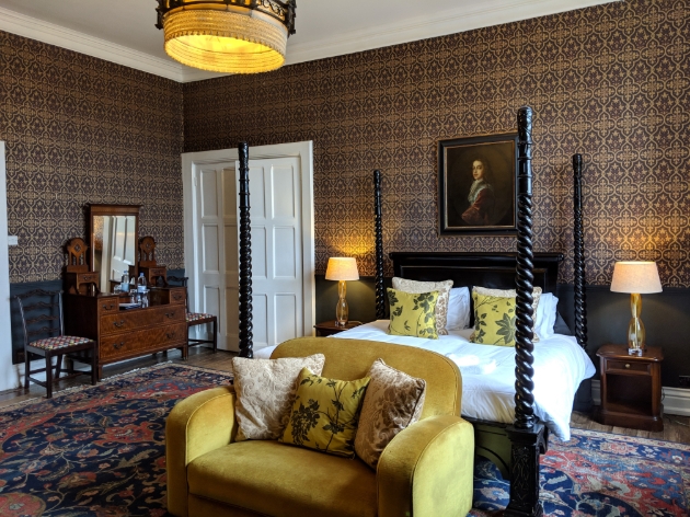 Huntsham Court, Devon, suite with four-poster bed and window