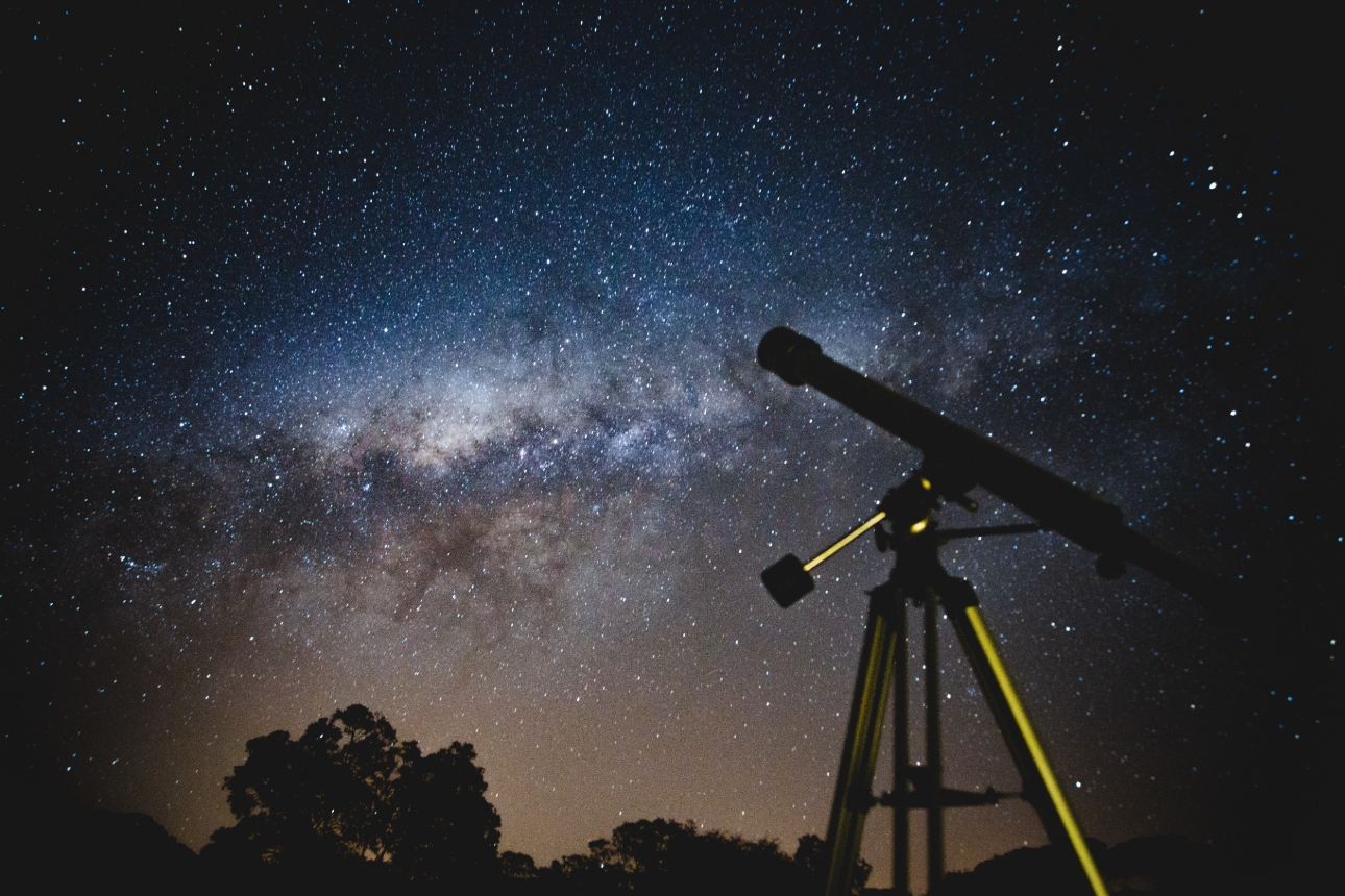 night sky with stars and telescope