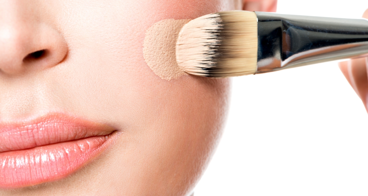 Close up of woman beginning to apply foundation