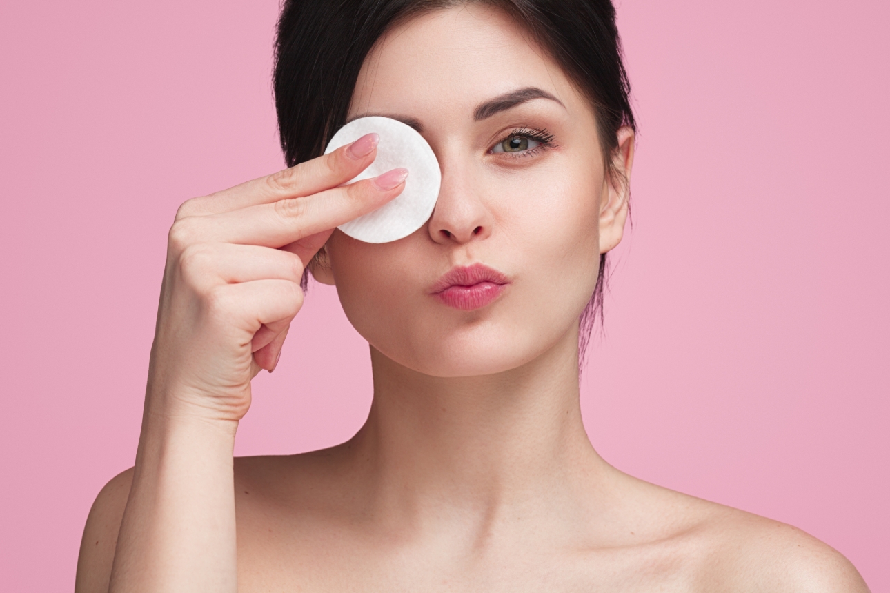 woman cleaning face