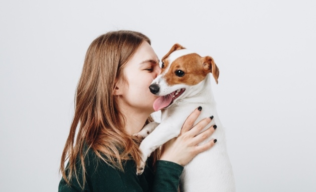 woman holding dog