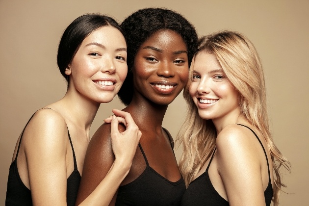 three women with glowing natural skin