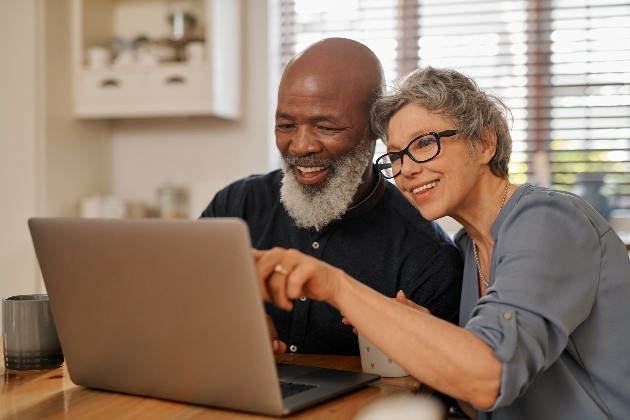 older couple looking at laptop