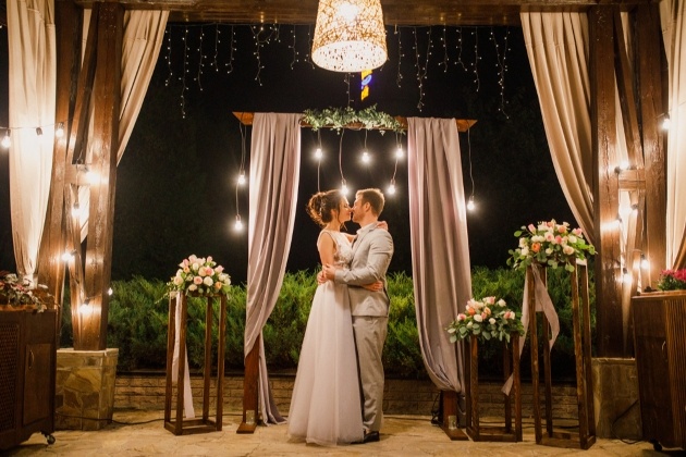 nighttime wedding bride and groom dancing 