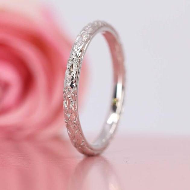 vintage patterned wedding band rose in background 