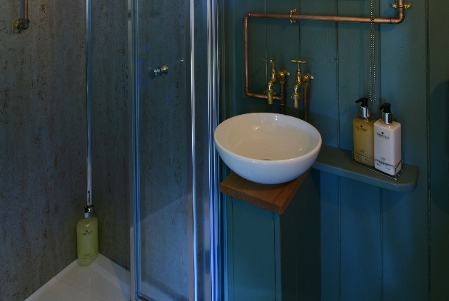 blue wood bathroom sink and shower