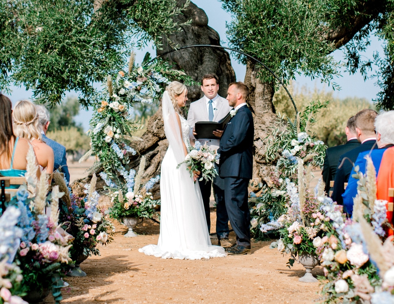 couple in front of flower moongate