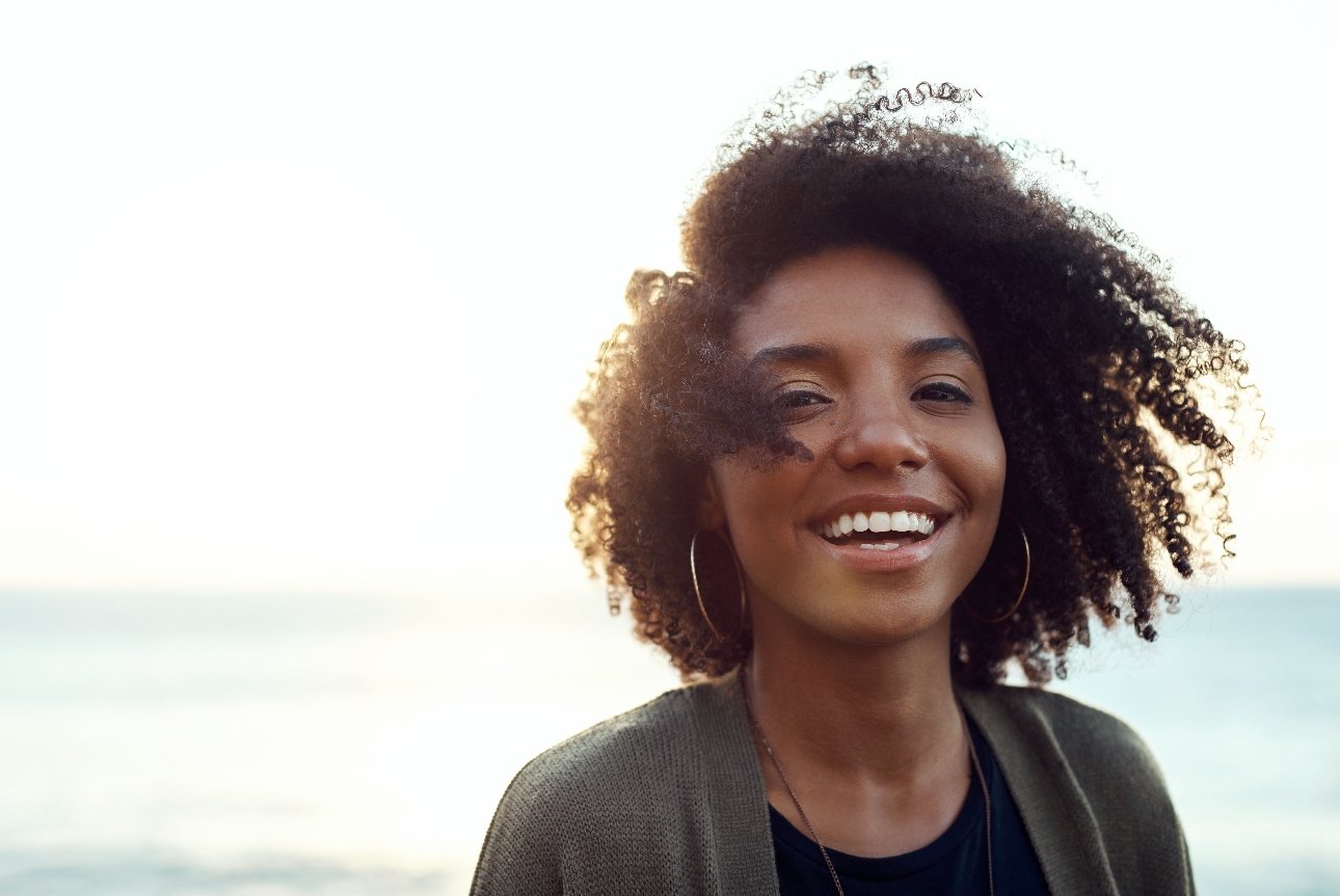 woman in sun smiling