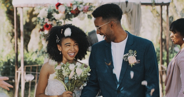 couple just wed walking down aisle