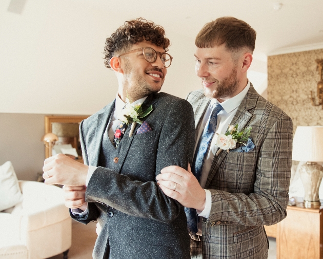 couple in suits getting married