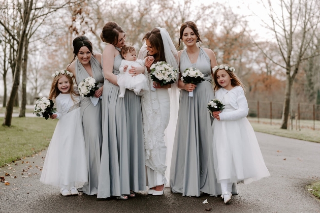 bride with bridesmaids in grey multiway dresses