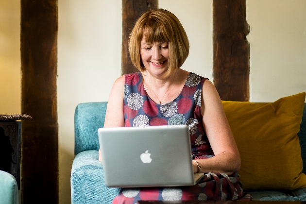 lady on a sofa on a lap top