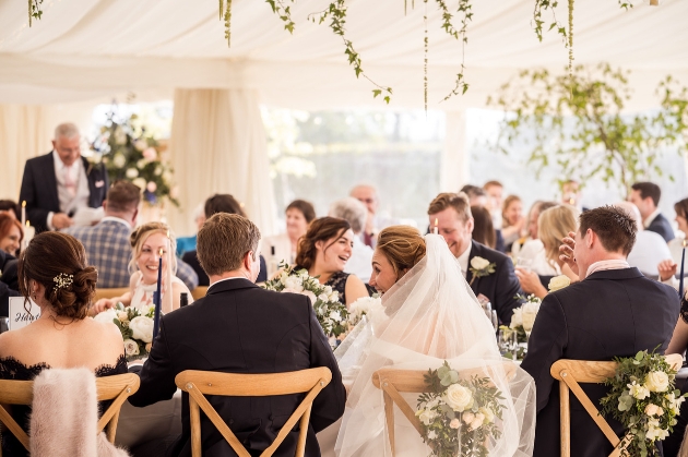 couple at their wedding breakfast table 