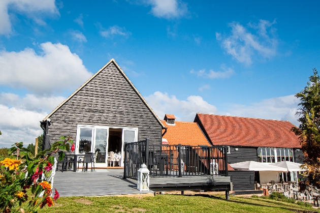 barns style black wood building with terrace