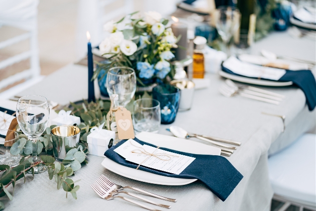 wedding reception set up with blue and green details