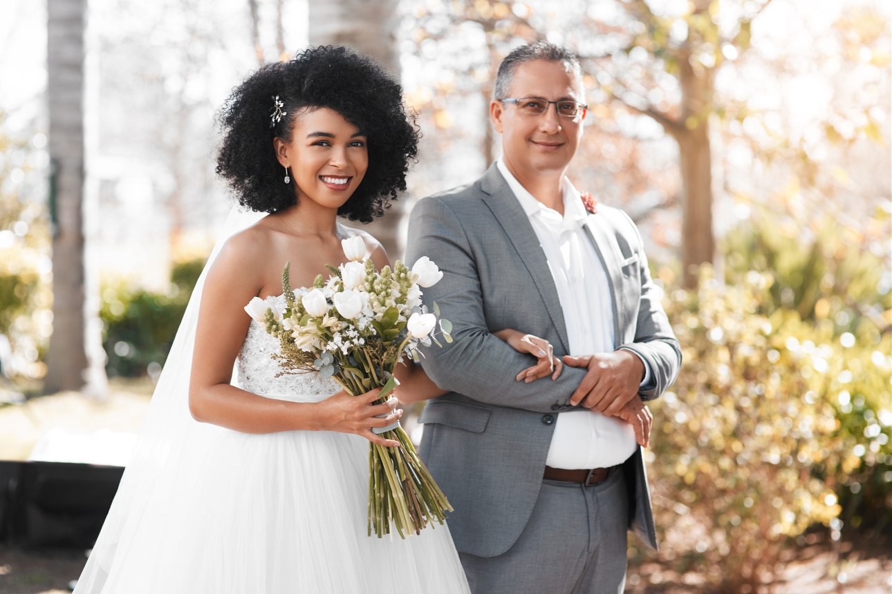 bride being walked down the aisle by her dad