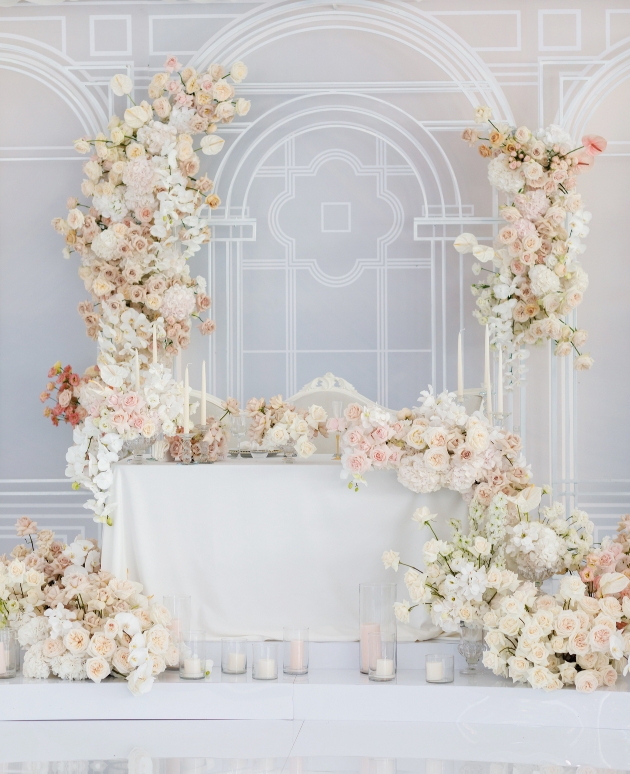 top table with masses of luxury white flowers