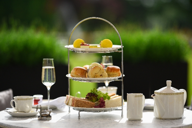 Afternoon Tea cake stands with cakes and sandwiches 