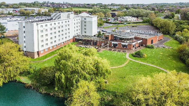 Holiday Inn Basildon white building with lake and car park