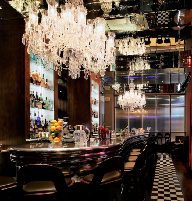 interior of hotel bar, huge crystal chandeliers art deco bar and style