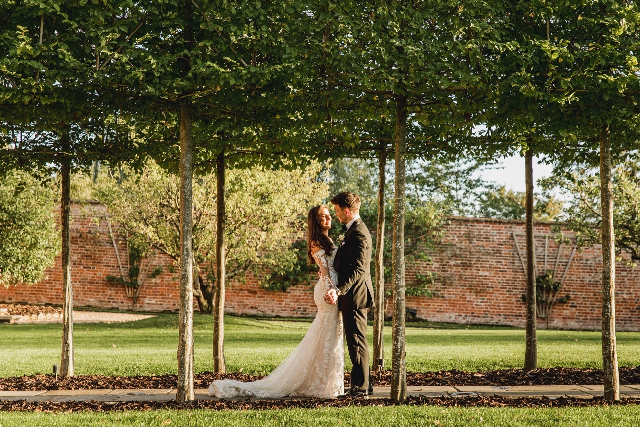 Couple stand in the garden