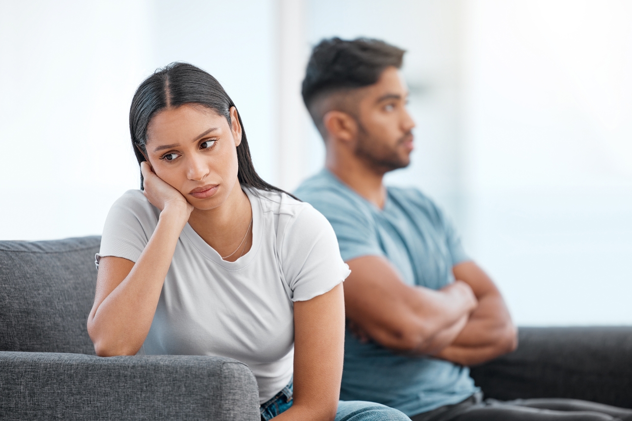 couple not talking to eachother on a sofa