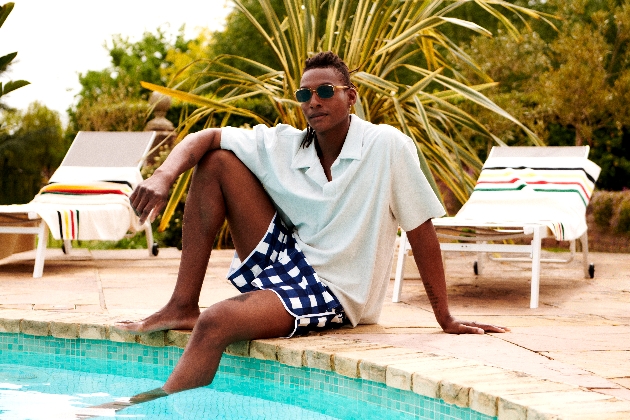 Man smiling by the pool