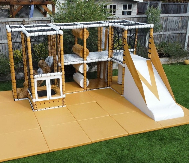 large outdoor play frame in white and gold