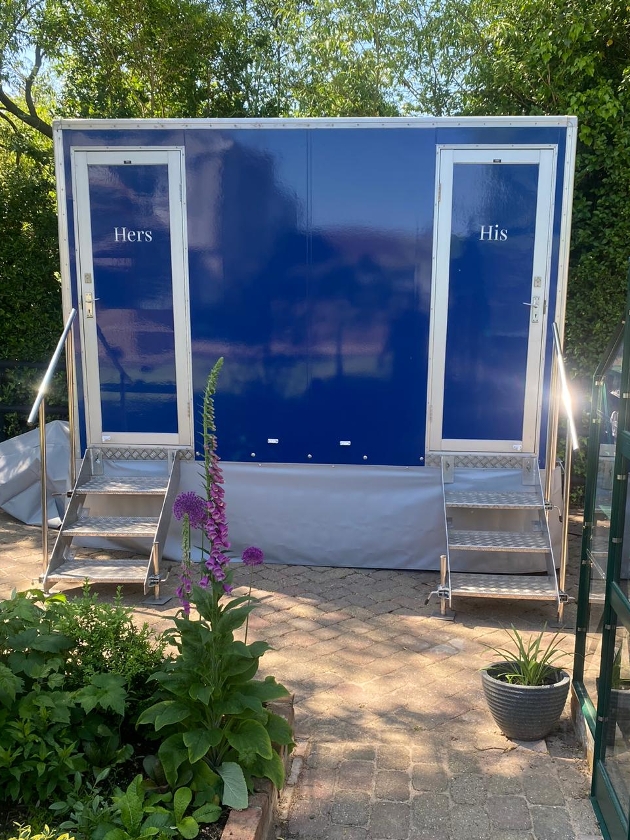 outdoor loo in a blue cabin