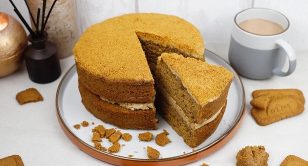 lotus biscoff cake next to a coffee mug