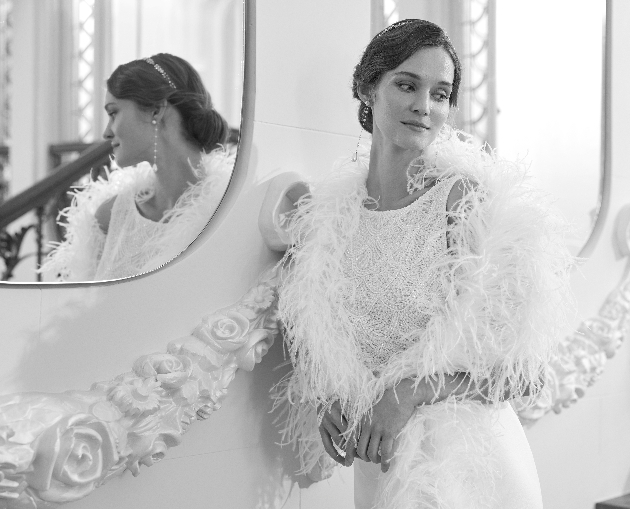 model in diamante dress with a feathered bolero