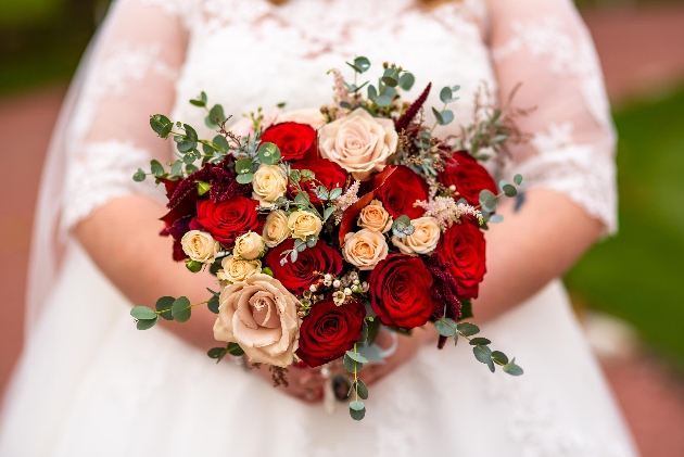bridal bouquet of red white and cream