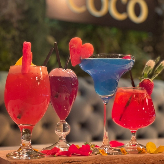 four coloured cocktails on the side