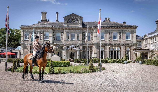 Lady on horse outside Down Hall Hotel