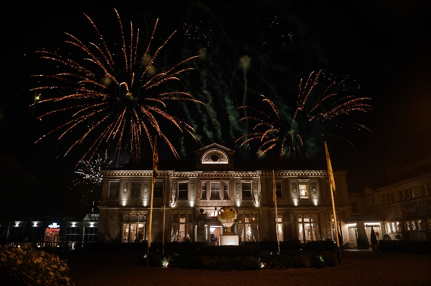 fireworks exploding over manor house