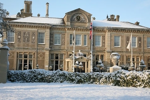 snow covered manor house