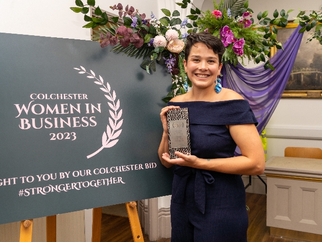 woman standing with award