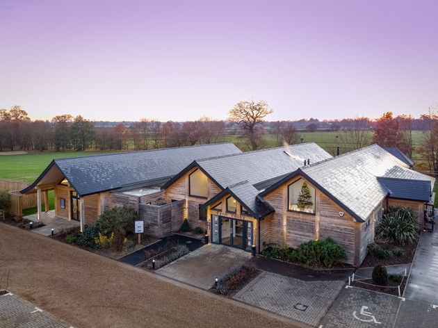 modern wooden building with views of golf course