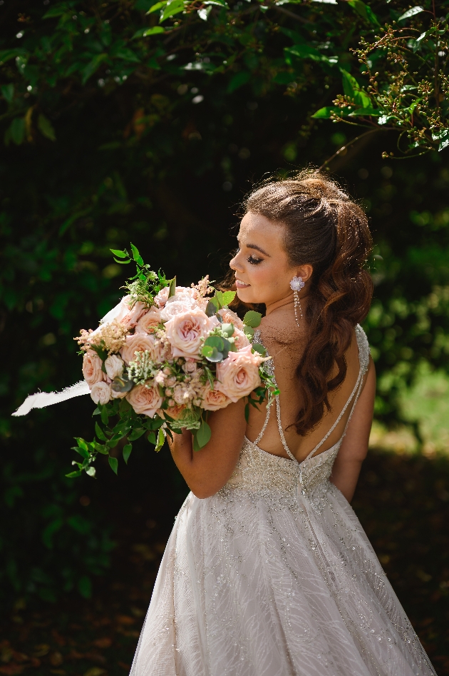 bride wearing backless gown