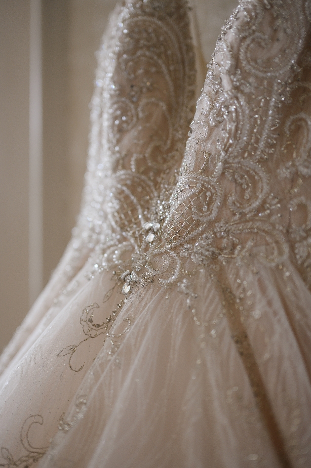 closeup of beadwork on bridal gown