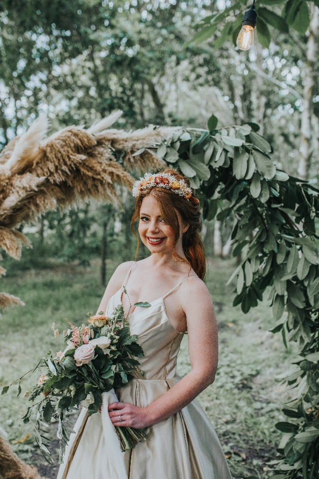 bride in champagne coloured satin dress with red hair