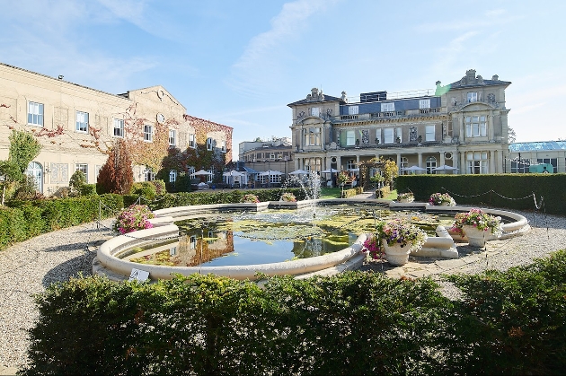 grand manor front with water fountain