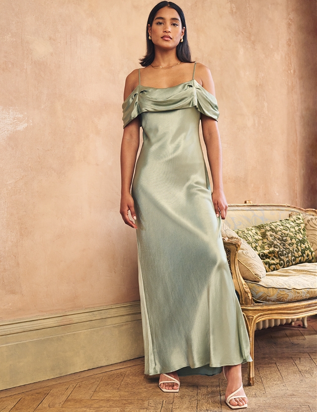 model in sage green satin dress cowl neckline