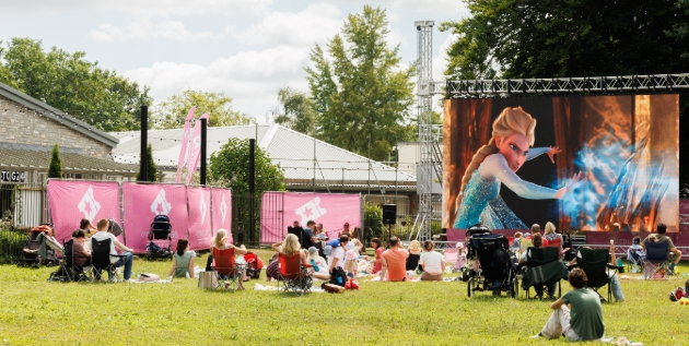 outdoor cinema screen showing Frozen the film