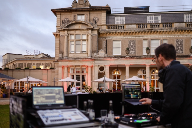 dj playing in evening at country house 