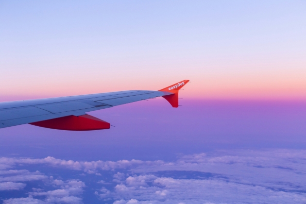 easyJet plane wing above the clouds