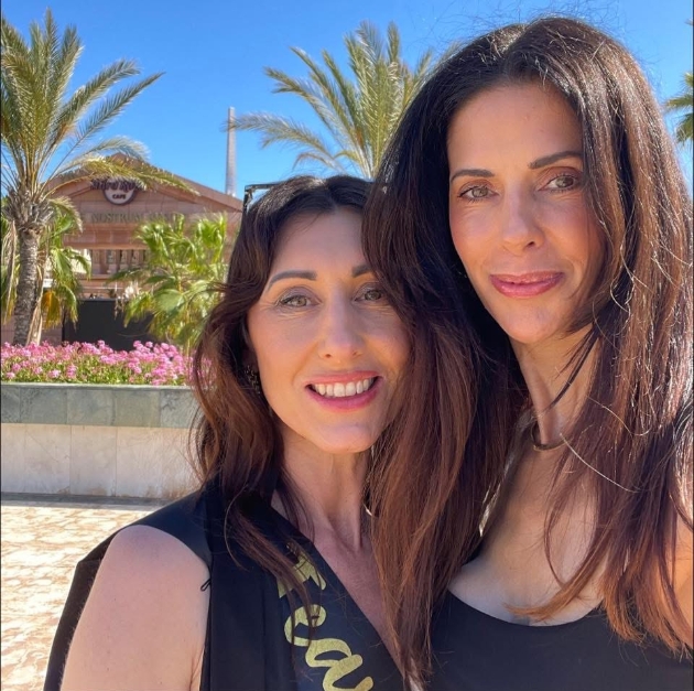 headshot of two brunette women